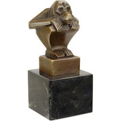 A BRONZE SCULPTURE OF A SQUATTING MONKEY