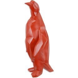 A RESIN POLYGONAL FIGURINE OF A PENGUIN, RED