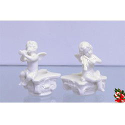 A PAIR OF FIGURAL CANDLE HOLDERS