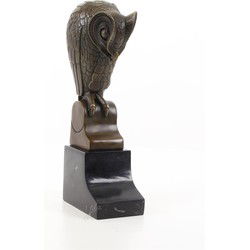 A BRONZE SCULPTURE OF AN OWL