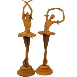 A PAIR OF RUSTY CAST IRON DANCER STATUES