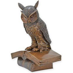 A BRONZE SCULPTURE OF THE WISE OWL SITTING ON A BOOK