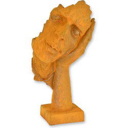 A RUSTY CAST IRON FIGURINE "HEAR NO EVIL"