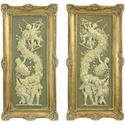 A PAIR OF FRAMED RESIN PLAQUES