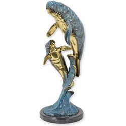 A BRONZE SCULPTURE OF A MANATEE WITH YOUNG