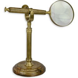 EEN MESSING VERGROOTGLAS OP EEN STANDAARD
