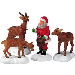 Santa feeds reindeer