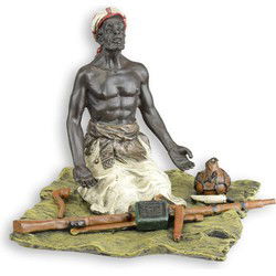 A BRONZE SCULPTURE OF A SEATED ARMS DEALER