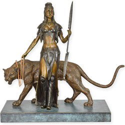 A BRONZE SCULPTURE OF A WOMAN WITH A TIGER