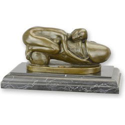 A BRONZE SCULPTURE OF A WOMAN EMBRACING A PHALLUS