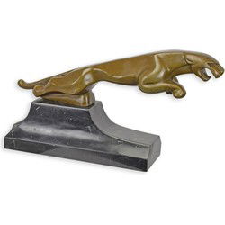 A BRONZE SCULPTURE OF A JAGUAR