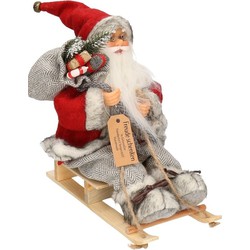 Kerstman op slee decoratie pop 30 cm - Kerstman pop