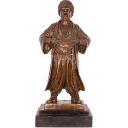 A BRONZE SCULPTURE OF A COSSACK