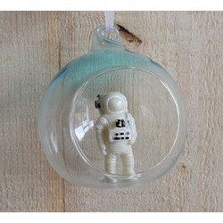 glass ball with spaceman inside