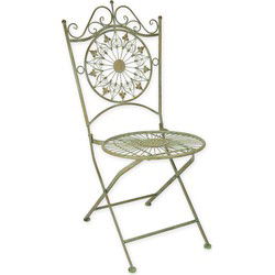 AN IRON FOLDING CHAIR