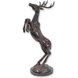 A BRONZE SCULPTURE OF A JUMPING DEER ON A MARBLE BASE