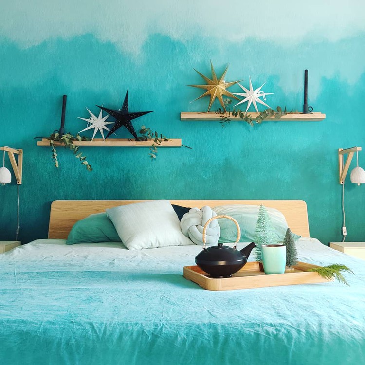 Slaapkamer met veel blauw- en groentinten