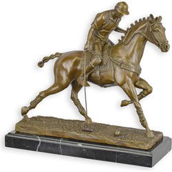 A BRONZE SCULPTURE OF A POLO PLAYER