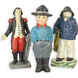 A SET OF 3 CAST IRON FIGURAL BANKS