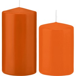 Stompkaarsen set van 4x stuks oranje 12 en 15 cm - Stompkaarsen