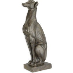 A RESIN FIGURINE OF A SITTING GREYHOUND
