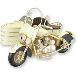 A TIN MODEL OF A MOTORCYCLE WITH SIDE CAR