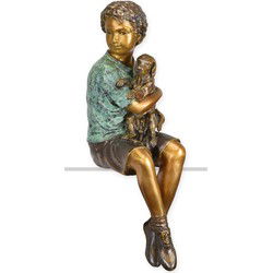 A BRONZE SCULPTURE OF A BOY HOLDING HIS DOG