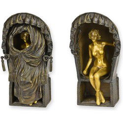 A BRONZE SCULPTURE OF A FEMALE NUD EIN BEACH CHAIR