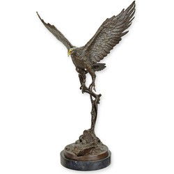 A BRONZE SCULPTURE OF AN EAGLE IN FLIGHT